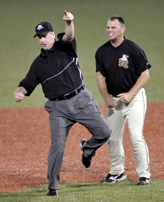 Second Place, Sports Feature - David Richard / FreelanceFrontier League umpire Jim Shaly (left) ejects River City manager Chad Parker after Parker rushed the field to argue a force out at second base in the ninth inning of Game 4 of the championship series.