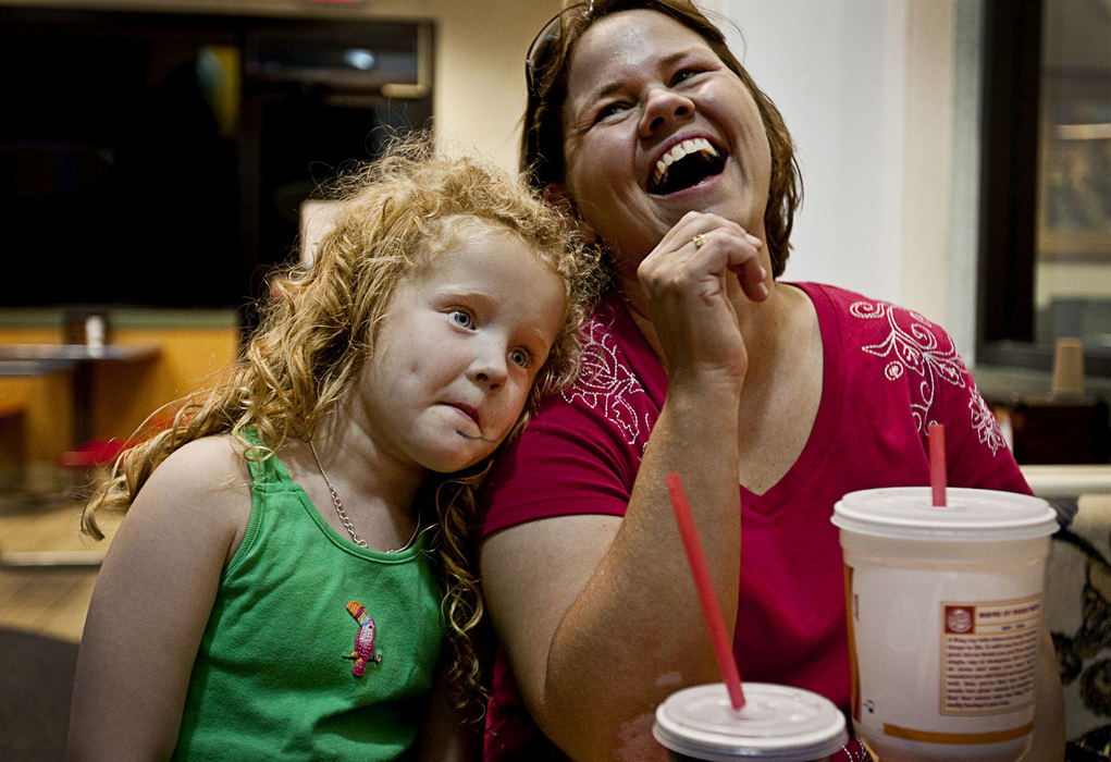 First Place, Student Photographer of the Year - Diego James Robles / Ohio UniversityJana laughs at the mysterious smudge on her daughter's face while making good on her promise to take her to Burger King if she won the crown in Nelsonville. "We won Sissy (Tomi Sue), we won!" Jana said. 