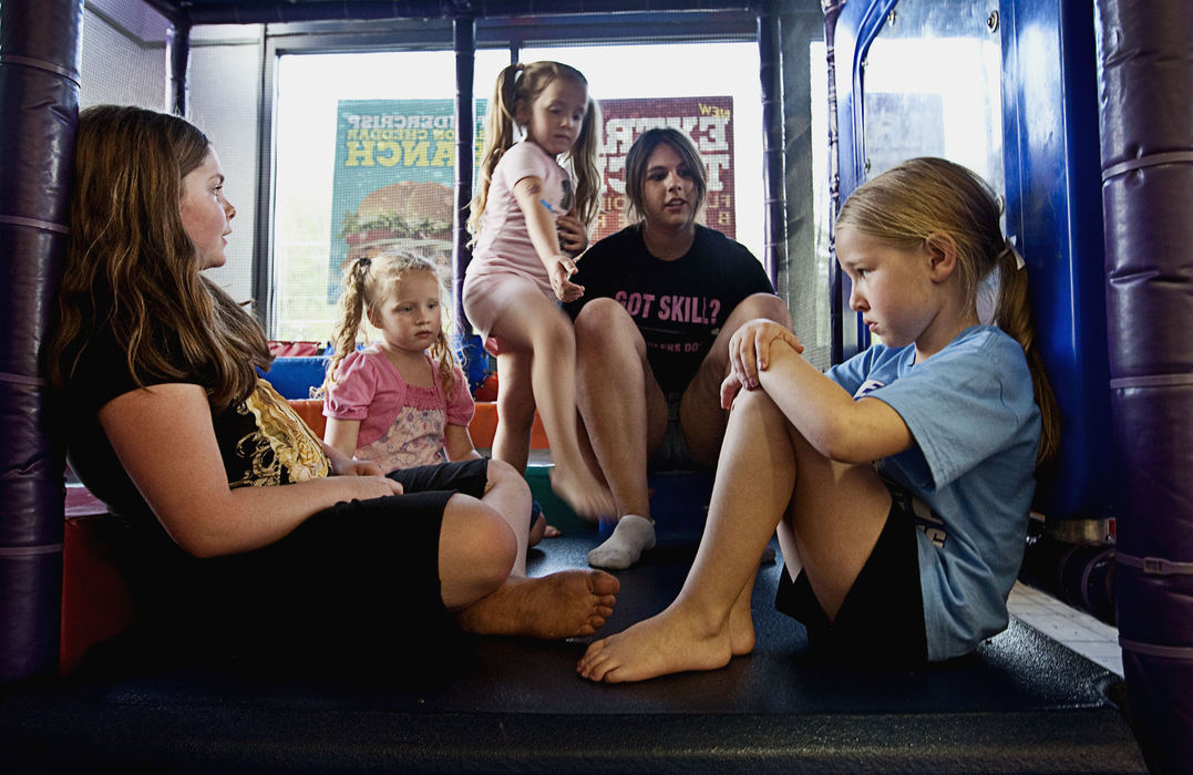 First Place, Student Photographer of the Year - Diego James Robles / Ohio UniversityWhile their parents argue over the pageant logistics and details (from left) Racheal LeAnn Frost, Tomi Sue Schweikert, Alexis Thompson and Stormy Daniels try, unsuccessfully, to console Heidi Jo McGrady on April 27. McGrady was accidentally stepped-on while the girls jumped in the Nelsonville Burger King play-pen.  