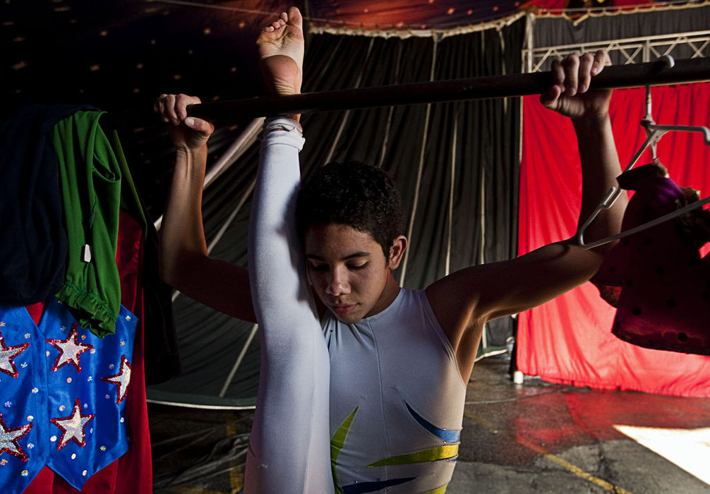 First Place, Student Photographer of the Year - Diego James Robles / Ohio UniversityKevin Zandrac, 15, from Colombia, stretches before a performance on Thursday, March 26. Zandrac has been a contortionist in the Carson & Barnes Circus since he was an infant while his father Julio is the head tent engineer. Doctors have told him to stop contorting his body so extremely because eventually it will lead to long-term joint problems in the future. “I want to be in Cirque Du Soleil so I don’t care what the doctors think,” Zandrac said.