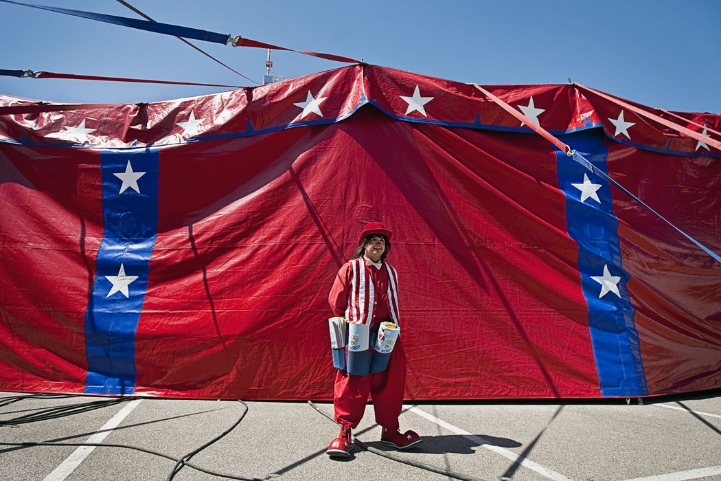 First Place, Student Photographer of the Year - Diego James Robles / Ohio UniversityMarquino, a veteran clown from Venezuela, waits outside the tent on Sunday afternoon, March 29, for the part of the show where he sells the official Carson & Barnes Circus coloring book inside center ring. All artists, entertainers, clowns and vendors receive a percentage of the money they make selling circus merchandize and concessions.