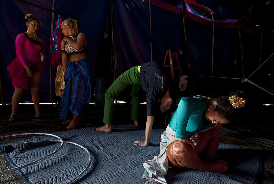 First Place, Student Photographer of the Year - Diego James Robles / Ohio UniversityPerformers in the Carson & Barnes Circus (from left) July Jacquelini Coronel, Ana Claudia Dos Santos, Kevin Zandrac and Carolina Morella, stretch and prepare before an afternoon show in the suburbs of Dallas, on March 26.