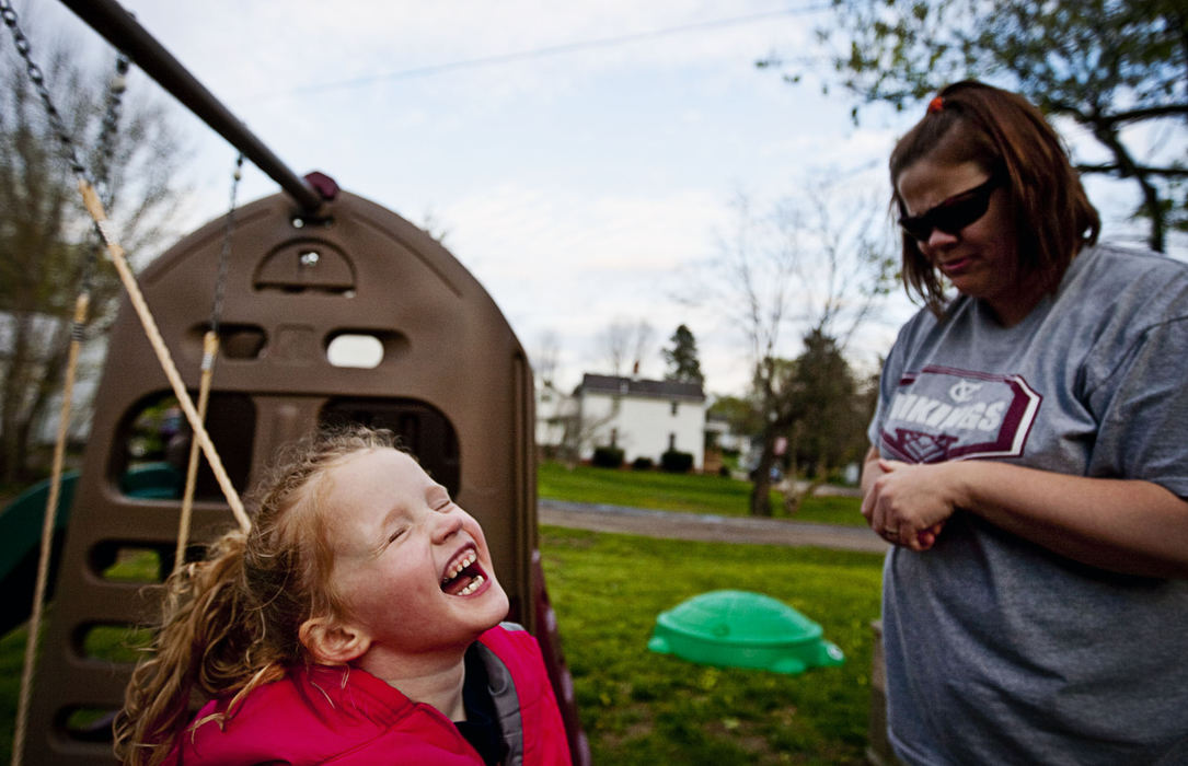First Place, Student Photographer of the Year - Diego James Robles / Ohio UniversityTomi Sue, 5, yells from her swing at her mother, Jana, after she tells her they must go inside before it starts raining, on April 21, in their McArthur home. Jana usually gives into her daughter's  wishes and laughs when she doesn't obey her.