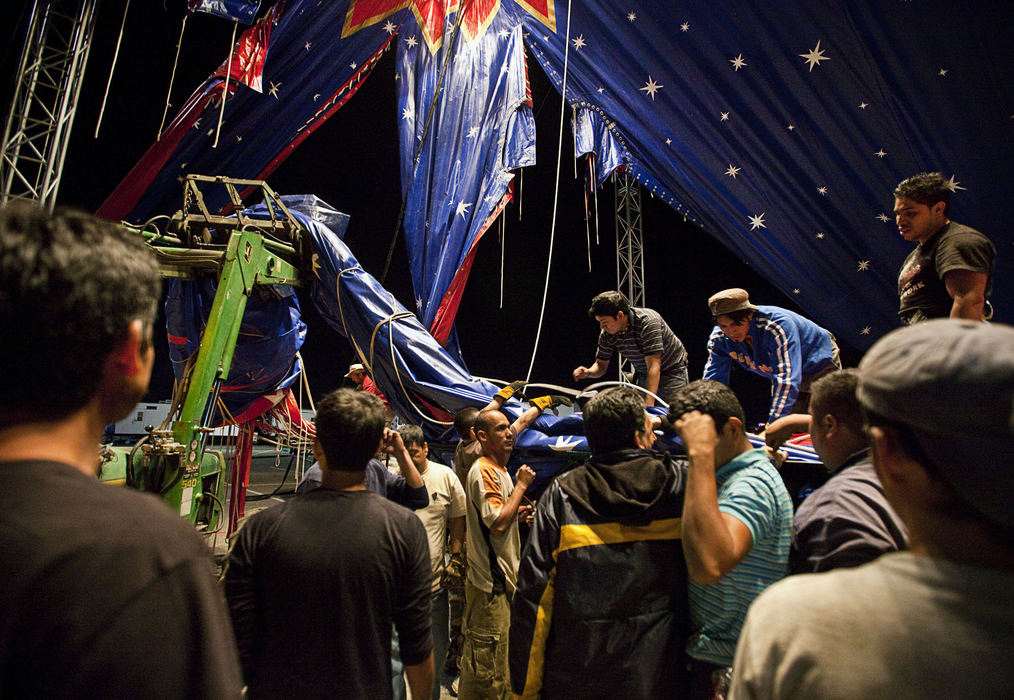 First Place, Student Photographer of the Year - Diego James Robles / Ohio UniversityJust after two a.m. in the suburbs of Dallas, the tent crew, exclusively made up of Latin American immigrants, struggle to disassemble the brand-new Carson & Barnes Circus tent, on Wednesday, March 25. Although the tent crew was able to put away their old tent in a matter of a few short hours, the new more sophisticated one takes them more than six hours and many times the effort.