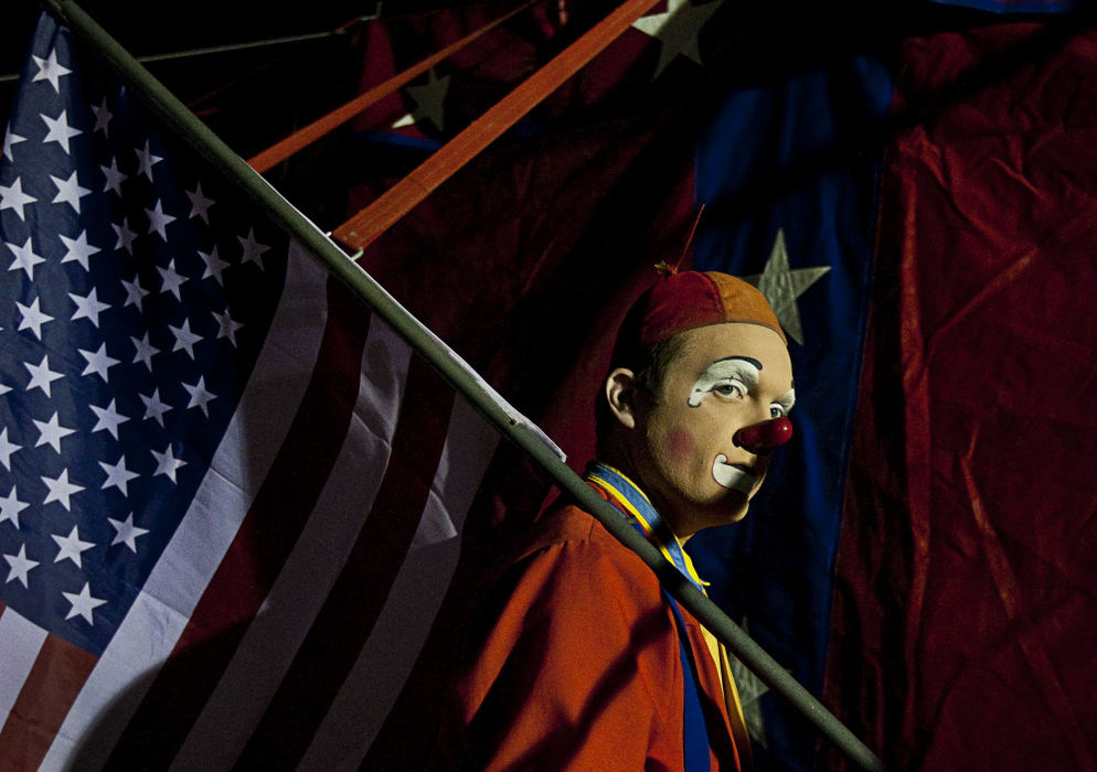 First Place, Student Photographer of the Year - Diego James Robles / Ohio UniversityMelvino the Clown gets ready to run into the main ring during the last act of the night, on Tuesday, March 24. One of the youngest clowns with Carson & Barnes, Melvino has been in several circuses in his short yet eventful career.