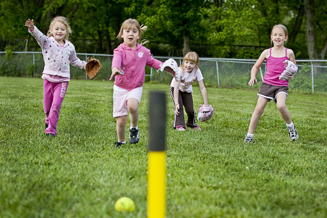 First Place, Student Photographer of the Year - Diego James Robles / Ohio UniversityFrom right, Heidi Jo, 6, and her t-ball teammates chase a loose ball during fielding practice in Logan, on May 11. Like most child beauty queens, Heidi is involved in numerous extracurricular activities. 