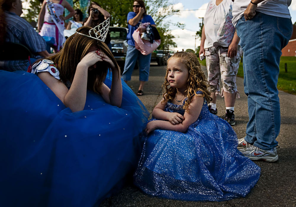 First Place, Student Photographer of the Year - Diego James Robles / Ohio UniversityWhile attending the mandatory Turkey Festival in McArthur, last year's Little Miss Congeniality, Tomi Sue tries to console last year's Chauncey Dover Spring Festival Queen, Jayla Beal, after she inadvertently ripped her dress on the festival’s float, on May 9. As part of their obligations as members of the court, pageant winners must attend and represent Chauncey Dover in several festivals throughout Southeast Ohio.