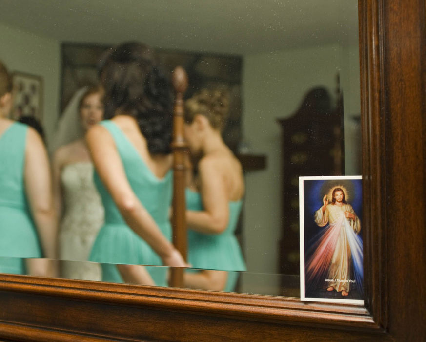 Third Place, Student Photographer of the Year - Laura Torchia / Kent State UniversityA bride takes a moment with her maid of honor and bridesmaids before marrying her high school sweetheart.