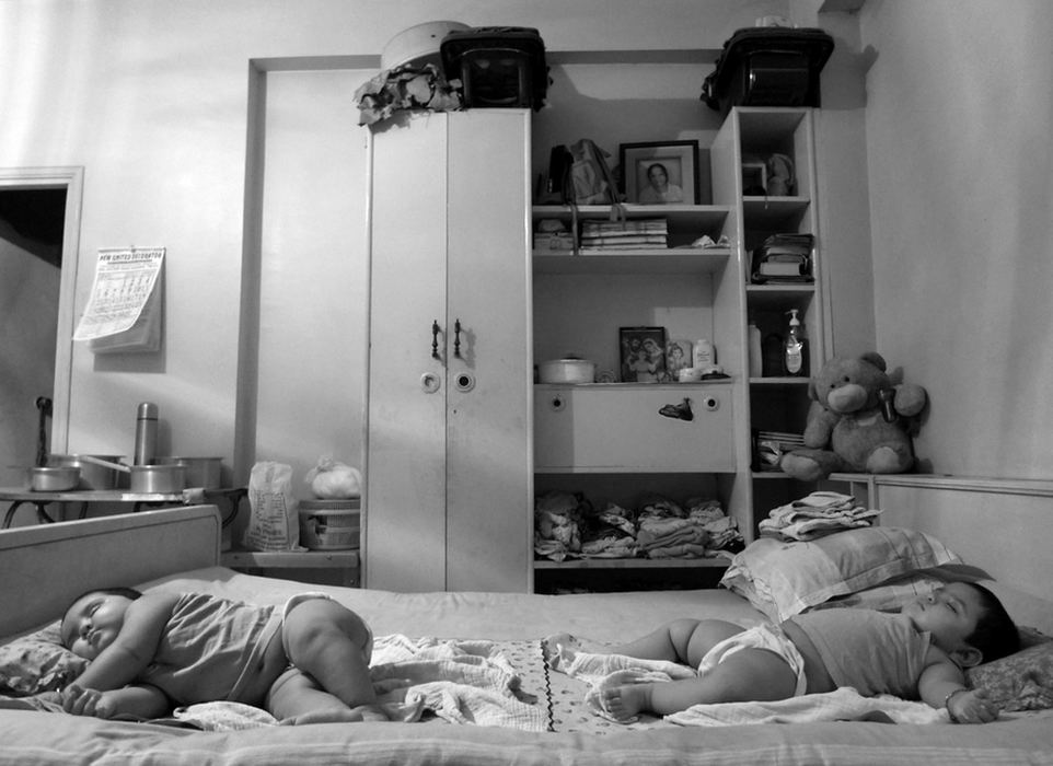 Third Place, Student Photographer of the Year - Laura Torchia / Kent State UniversityTwins Orna and Raina, nine months old, sleep peacefully in their room in Kolkata, India.