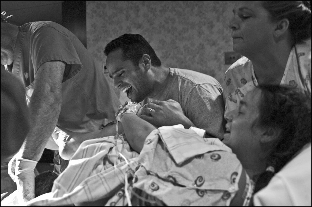 Third Place, Student Photographer of the Year - Laura Torchia / Kent State UniversityFather Ivan Reed cries out after catching his first glimpse of his daughter Venice.
