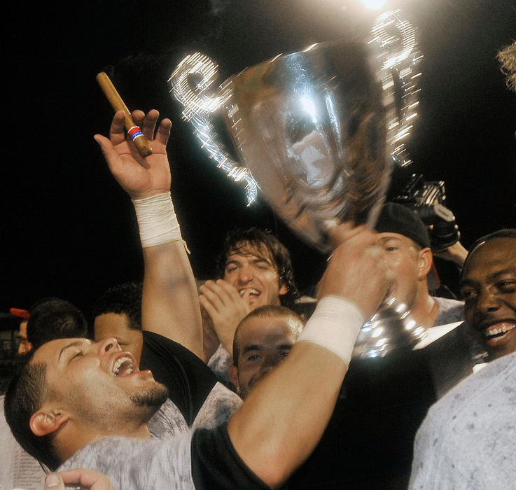 First Place, Sports Picture Story - David Richard / FreelanceThe players celebrate the Frontier League championship.