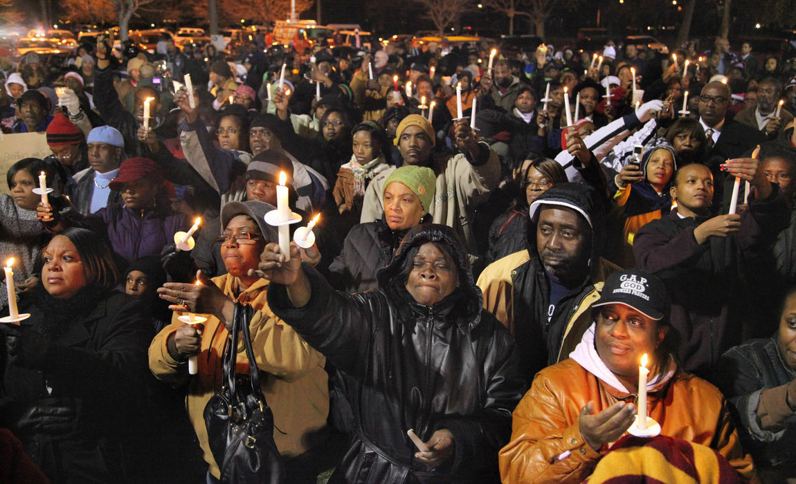 First Place, Team Picture Story - Thomas Ondrey / The Plain DealerSeveral hundred people gather in Luke Easter Park, just blocks away from the site of the murders, for a vigil in remembrance of the victims.