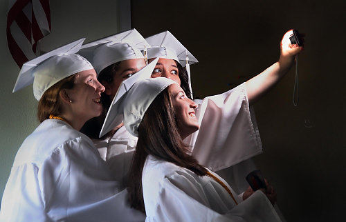 Award of Excellence, Feature - Gus Chan / The Plain DealerSeniors Camille Davis, Noha Bechara, Alex Skufca and Molly Nobbe pose for a group picture before commencement.  The commencement would be the high school's last.