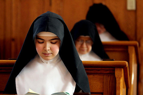 First Place, Feature Picture Story - Lisa DeJong / The Plain DealerSister Faustina, 23, is the youngest nun in the monastery. For many years, the Cleveland sisters numbered upward of 40 members. Today, the group numbers about 20 women. Some of the sisters entered the cloister as teenagers. Others pursued careers, dated and lived workaday lives for years before realizing their destiny. 