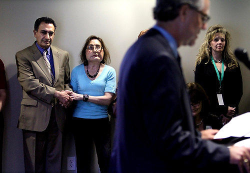 Second Place, Feature Picture Story - Lisa DeJong / The Plain DealerCleveland Clinic surgeon Bijan Eghtesad, a member of Connie Culp's transplant team, calms Connie's nerves before she gives a speech at an open house for the new offices of LifeBanc, the nonprofit organ and tissue recovery organization for Northeast Ohio. Connie hopes to give more speeches encouraging others to become organ and tissue donors. 