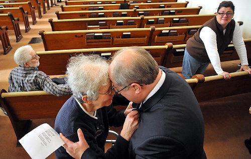 Second Place, General News - Bill Lackey / Springfield News-SunFormer Tremont City United Methodist Church pastor, Walter Mock, and longtime church pianist Mary Catherine Lutz say goodbye  following the final Sunday service at the church in Tremont City. The church was closing after more than 100 years due to the lack of participation. 