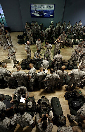 First Place, News Picture Story - Eric Albrecht / The Columbus DispatchSoldiers assemble gear after saying goodbyes to their families.