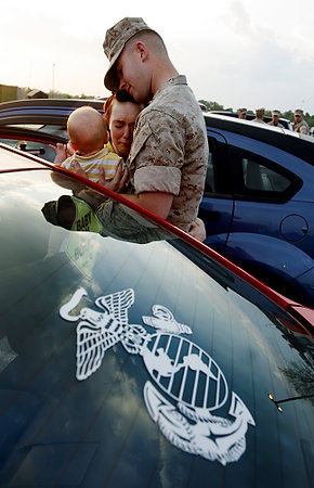 First Place, News Picture Story - Eric Albrecht / The Columbus DispatchCorporal Matt Hoops says goodbye to family Nichole and son Charlie 8 months after escorting them back to the car.