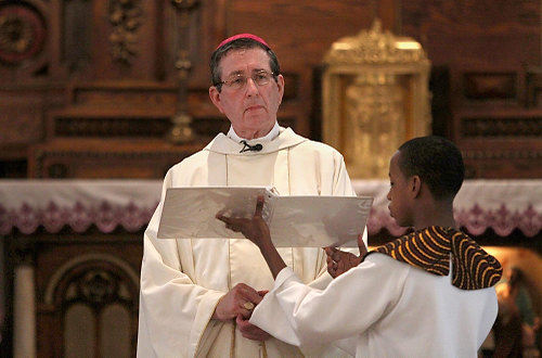 Second Place, News Picture Story - Gus Chan / The Plain DealerBishop Richard Lennon conducts the final mass at St. Adalbert Church.  St. Adalbert, home to Cleveland's oldest black Catholic congregation, closed it's doors Sunday morning as part of the diocesan downsizing.