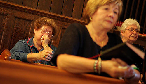 Second Place, News Picture Story - Gus Chan / The Plain DealerIrma Friedrich, a lifelong parishioner at St. Emeric Church, cries during a prayer service.