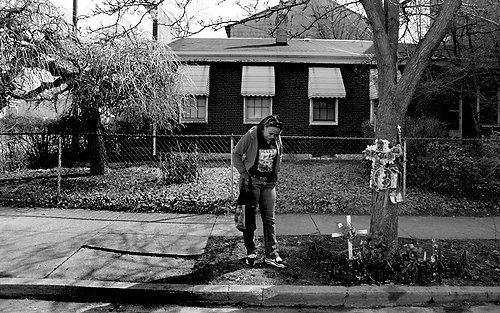 Third Place, News Picture story - Michael E. Keating / MIchael E. KeatingYevette Hooten grew up on the corner of Denham and Borden Sts. in CIncinnati. She moved from the area to provide a better life for her son Mark, 17. All was going well.  Mark got a summer job at a community center there and was gunned down, shot dead by an unknown assailant just after his mom dropped him off for work.  She goes back there often and hopes for closure.