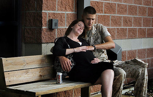 First Place, News Picture Story - Eric Albrecht / The Columbus DispatchCorporal Brandon Schoen shares a moment with his wife Beth Schoen  who is expecting in two weeks.