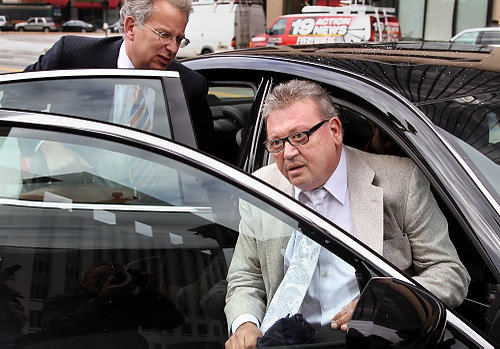 First Place, James R. Gordon Ohio Understanding Award - Gus Chan / The Plain DealerFormer Cuyahoga County Auditor Frank Russo arrives at federal court on Sept. 16 with his attorney, Roger Synenberg.  He pleaded guilty to 21 charges.