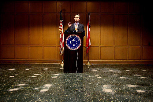 First Place, James R. Gordon Ohio Understanding Award - Lisa DeJong / The Plain DealerCuyahoga County Executive Ed FitzGerald speaks about an ethics policy for his new government during a news conference inside the new council meeting room at the Cuyahoga County Administration Building on Jan. 3, the first day of the revamped charter government.  The white spots on the floor are where the tables and chairs used to be for the county commissioners and have been pulled out to renovate the room for the new county council.