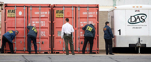First Place, James R. Gordon Ohio Understanding Award - Scott Shaw / The Plain DealerFederal agents prepare to search truck containers on July 28, 2008, at DAS Construction Co. in Garfield Heights. The company is being targeted in a public corruption probe with businesses and Cuyahoga County officials, including Commissioner Jimmy Dimora and Auditor Frank Russo.  Agents hauled away dozens of boxes from the offices, homes and businesses.   