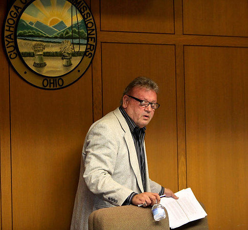 First Place, James R. Gordon Ohio Understanding Award - Marvin Fong / The Plain DealerCuyahoga County Auditor Frank Russo leaves a Board of Revision meeting.  Russo later resigned and was charged with 21 counts of bribery and corruption.