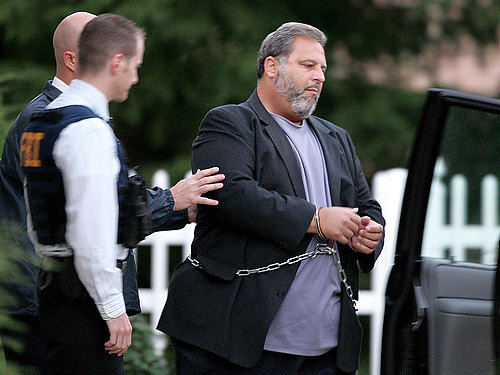 First Place, James R. Gordon Ohio Understanding Award - Marvin Fong / The Plain DealerCuyahoga county commissioner Jimmy Dimora is led out of his Independence home in handcuffs by FBI agents on Sept. 15, 2010.   Dimora was indicted on 26 counts involving corruption and other crimes.   He pleaded not guilty to the charges.  