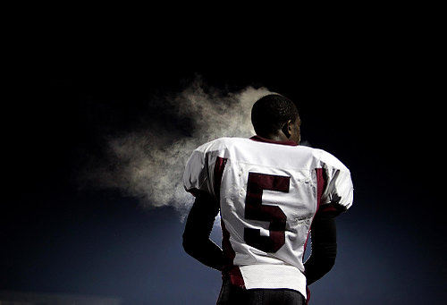 First Place, Photographer of the Year/Large Market - Lisa DeJong / The Plain DealerSteam rolls off the head of Maple Heights Mike Hollins in the chilly night air during their game against Sandusky at Avon Lake Memorial Stadium in Avon Lake.  Maple Heights won 61-27.