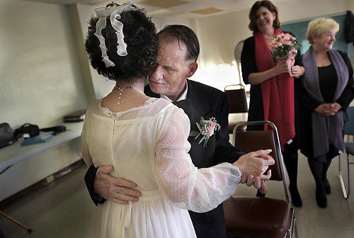 Second Place, Photographer of the Year/Large Market - Gus Chan / The Plain DealerArthur Suminiski, who's better known as Pee Wee, dances with his wife of 13 year, Joyce, during a renewal of vows ceremony Saturday, January 9, 2010.  The Suminskis are a onetime homeless couple who have been adopted by the Helping Hands ministry of St. Paschal Church.  The dress and tux were provided by the ministry.