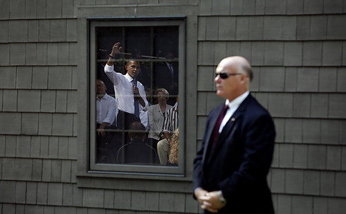 Third Place, Photographer of the Year/Large Market - Eric Albrecht / The Columbus Dispatch President Obama is reflected in a garage window under the eye of a Secret Service agent as the president met with community residents to talk about the economy.