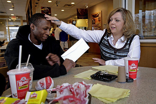 Third Place, Photographer of the Year/Large Market - Eric Albrecht / The Columbus DispatchRobert visits with Angela Lariviere from the Coalition of Homelessness at a fast food restaurant . Angela is the only constant support for Robert and often helps him finically and emotionally.Robert Payne is a teenager who has limited contact with his parents and is in limbo living on his own with some support from social agencies and occasionally working and still struggling to go to high school. Robert's situation reflects how little help there is for teenagers trying to bridge the gap from youth to adult.