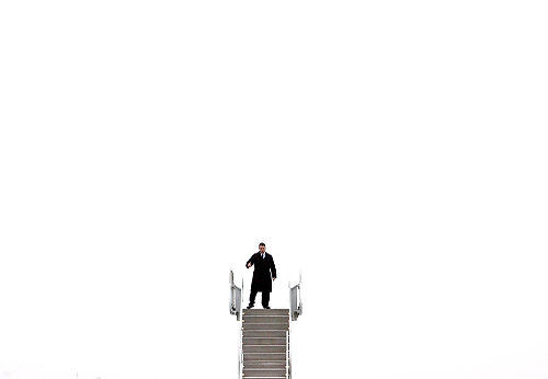 First Place, Photographer of the Year/Large Market - Lisa DeJong / The Plain DealerA secret service agent checks the plane stairs that will connect to Air Force One at Atlantic Aviation in Cleveland. The stairs were sitting on the tarmac awaiting the scheduled arrival of President Barack Obama. 