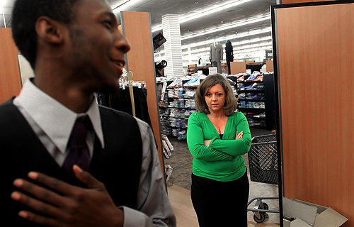 Third Place, Photographer of the Year/Large Market - Eric Albrecht / The Columbus DispatchRobert  tries on new set of clothes for the homecoming dance at his school as Angela watches. Angela had taken him shopping for some new clothes.
