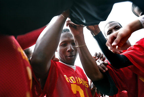 Third Place, Photographer of the Year/Large Market - Eric Albrecht / The Columbus Dispatch Robert joins the huddle for a flag football game. When Robert had more stability he had played high school football and dreamed of maybe playing college football.