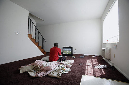 Third Place, Photographer of the Year/Large Market - Eric Albrecht / The Columbus DispatchRobert had a video game but no furniture when he moved into a new apartment.