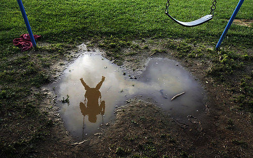 Third Place, Photographer of the Year/Large Market - Eric Albrecht / The Columbus DispatchRecent rains keeps Destiny Cilluffo  feet swinging high after rains soaked the park she was playing at.