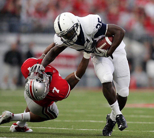 Third Place, Photographer of the Year/Large Market - Eric Albrecht / The Columbus DispatchPenn State running back stiff arms Ohio State's Jermale Hines for a gain in a Big Ten game.