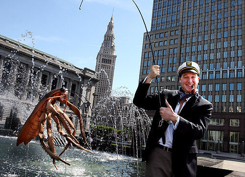 Third Place, Portrait Personality - Lynn Ischay / The Plain DealerMike Polk, producer of the 'hastily made Cleveland videos,' goes fishing in the fountain at the War Memorial in Cleveland. Polk, a nationally recognized comedian, loves his hometown, and loves to poke fun at it.