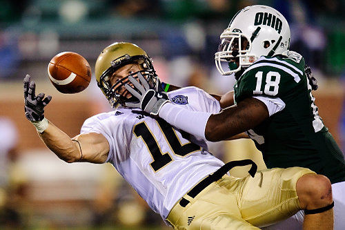 First Place, Sports Action - Joel Hawksley / Ohio UniversityOhio cornerback Travis Carrie and Wofford Terriers wide receiver Brenton Bersin fight for the ball during the NCAA football game between the Ohio University Bobcats and the Wofford College Terriers at Peden Stadium in Athens, Ohio on Saturday September 4, 2010. Ohio defeated Wofford, 33-10.
