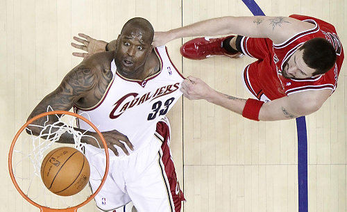 Third Place, Sports Action - John Kuntz / The Plain DealerCleveland Cavaliers Shaquille O'Neal can't believe he is being pulled down by his jersey by Chicago Bulls Brad Miller as O'Neal watches his score in the second period April 27, 2010 during game five of the Eastern Conference Playoff's first round at Quicken Loans Arena.  