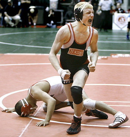 Third Place, Sports Feature - Andy Morrison / The (Toledo) BladeShane Brown from Akron Manchester reacts as a dejected Alex Lopez of Hamler Patrick Henry lays on the mat after Brown won their Division III 130-pound match for fifth place at the 73rd Annual State Wrestling Tournament in Columbus.