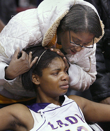 Award of Excellence, Sports Feature - Jeremy Wadsworth / The (Toledo) BladeWaite High School's Shanice McNeal (40) is comforted by her mother Annette Holmes after missing a time expired foul shot against Canton McKinley in the Division I girls basketball state championship game.