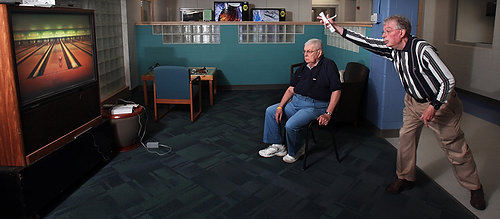 Award of Excellence, Sports Feature - Tom Dodge / The Columbus DispatchBill Hylton and Jack Kyle enjoy a game of wii sports bowling at Whetstone Recreation Center. This was the first day of their senior bowling league which meets twice a week.  Jack said he does it just for fun but Bill takes it quite seriously traveling to three different recreation centers to compete. 