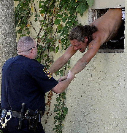 Second Place, Spot News under 100,000 - Marshall Gorby / Springfield News-SunPolice arrest Raymond Poe at the Old Fox's Den on a charge of breaking and entering and took him to the Clark County Jail. 