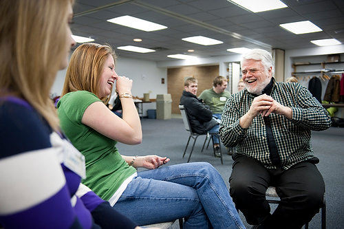 First Place, Student Photographer of the Year - Joel Hawksley / Ohio UniversityOhio University students Camee Decknadel and Kate McDougle share a laugh with Father Holler during a Newman Community meeting on January 13, 2010. Holler attends the weekly meetings as part of the church's campus outreach program, which is primarily student-led.