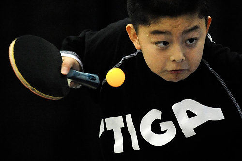 First Place, Student Photographer of the Year - Joel Hawksley / Ohio UniversityJames Wang, 11, hits the ball during the U.S. Open Table Tennis Tournament at DeVos Place on Wednesday, June 30, 2010.
